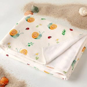 Toalla playa microfibra caracoles beige Kiokids